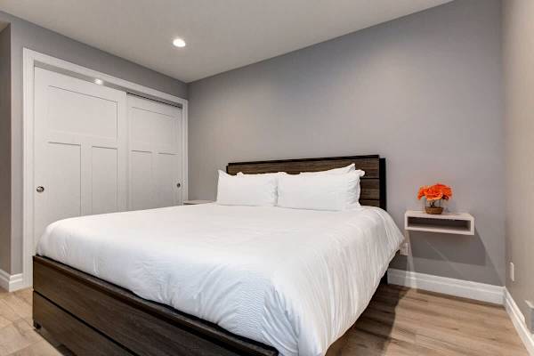 Bedroom 3 | Lower Level, King Bed, TV, Closet, Full Ensuite Bathroom with Shower/Tub Combo | Abode at First Chair