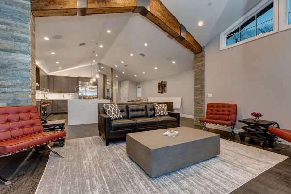 Living Area with Gas Fireplace, Open Floor Plan, Deck Access | Abode at First Chair