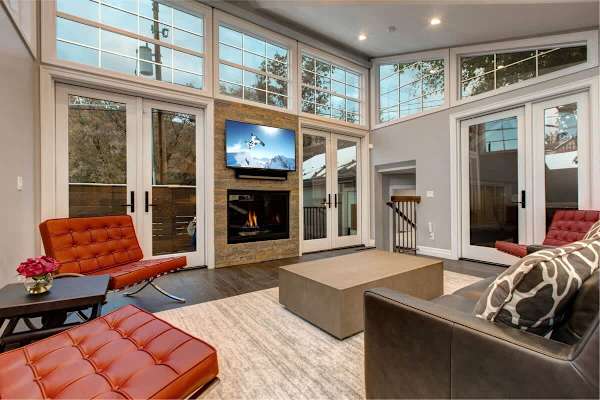 Living Area with Gas Fireplace, Open Floor Plan, Deck Access | Abode at First Chair