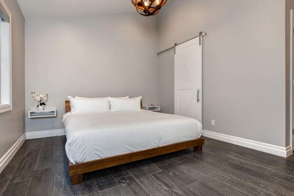 Bedroom 1 | Main Level, King Bed, Closet, TV, Full Ensuite Bathroom with Shower, His & Her's Sinks  | Abode at First Chair