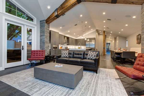 Living Area with Gas Fireplace, Open Floor Plan, Deck Access | Abode at First Chair