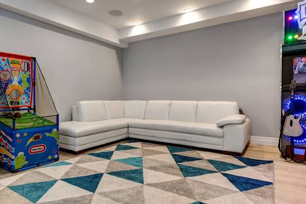 Media Room | Lower Level, TV, Shuffleboard, Arcade Legends, Guitar Hero, Whac-a-Mole & More! | Abode at First Chair