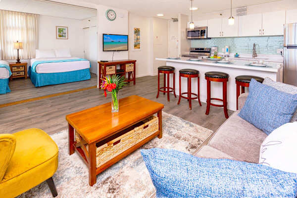 TV on the living room, sliding door separates the bedroom from the living room.
