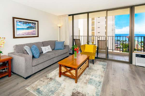 Living room with a pull-out sleeper sofa. Stunning ocean view and a window-type AC.