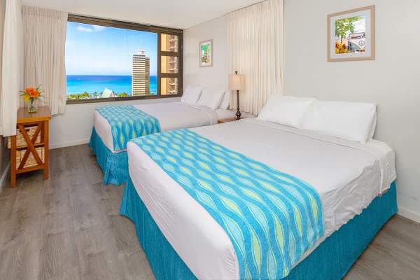 Have a comfortable sleep in your bedroom with two queen-sized beds plus a stunning ocean view!