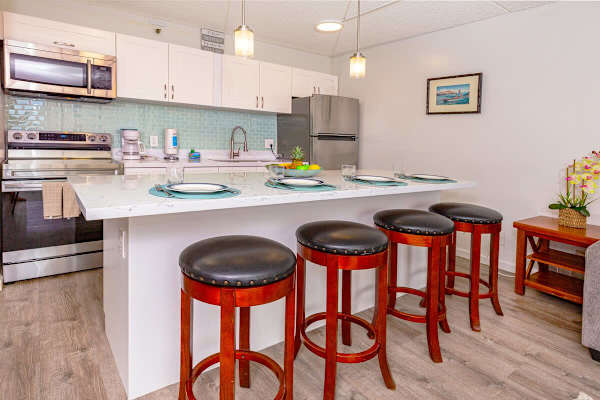 Fully equipped kitchen with dining area and full-sized appliances.