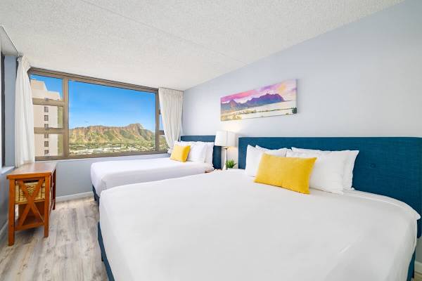 Bedroom with one king-size and one full-size bed