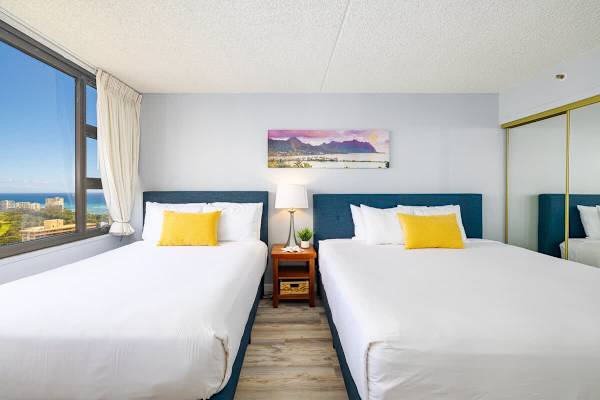 Bedroom with one king-size bed and one full-size bed