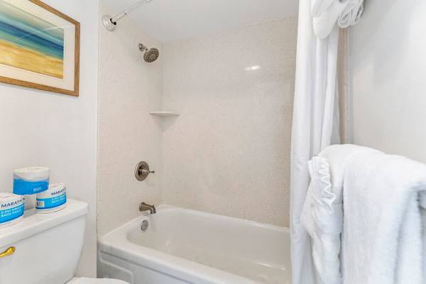 The full bathroom has a shower and tub combination!