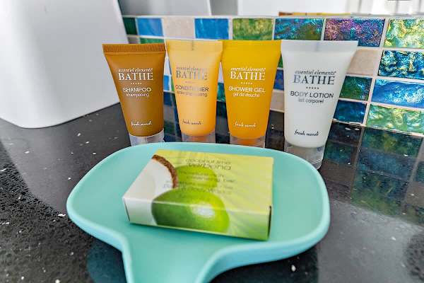 Startup amenities include soap, shampoo, conditioner, shower gel, and lotion