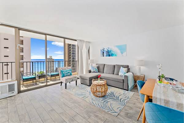Relax in the living room with a sectional pull-out sleeper sofa and beautiful views of the ocean from the outside! 