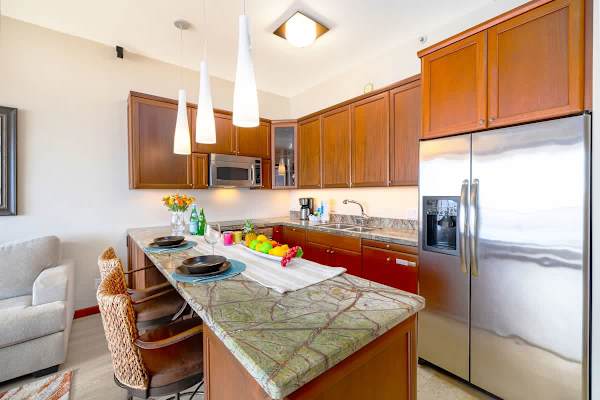 Fully equipped kitchen with dishwasher and countertop  with two bar stools!