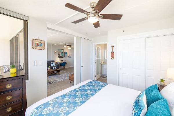Bedroom with king size bed, closet, and sliding door that can be closed for privacy