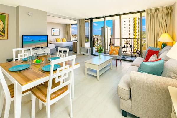 Bright and modern living space with dining area and balcony views.