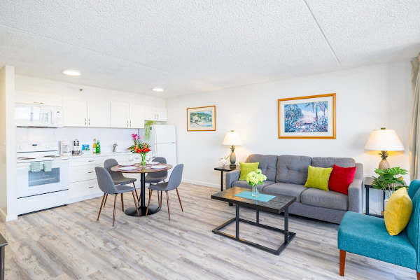 Bright open-plan living area with a modern kitchen and comfortable seating.