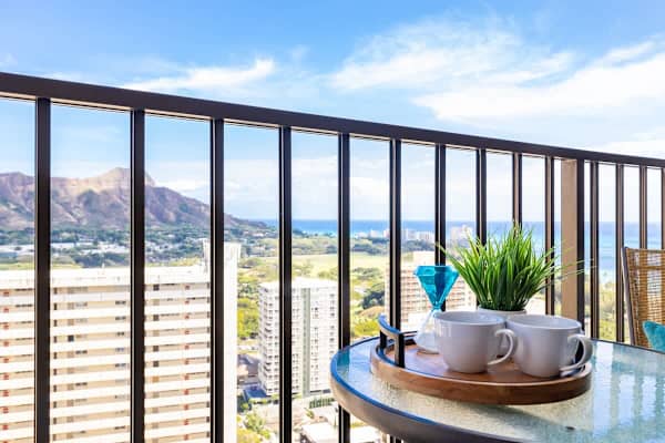 Enjoy morning coffee on the balcony with mountain and ocean views.