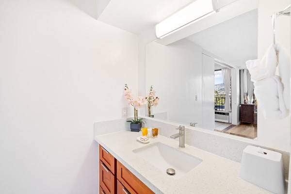 Full bathroom with vanity and cabinet.