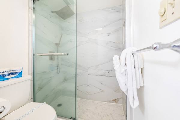 Full bathroom with walk-in shower.