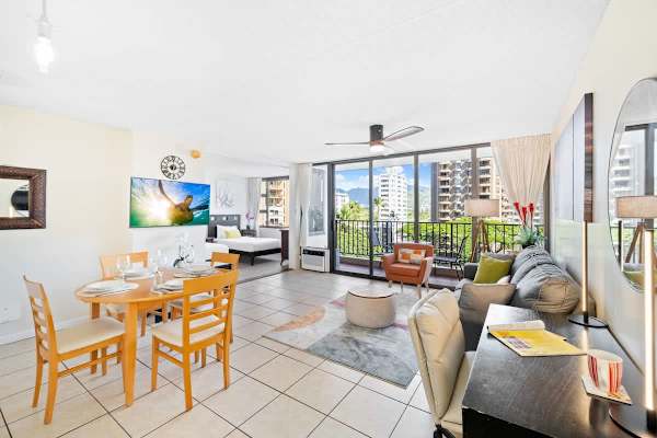Overview of the living and dining area with dedicated workspace.