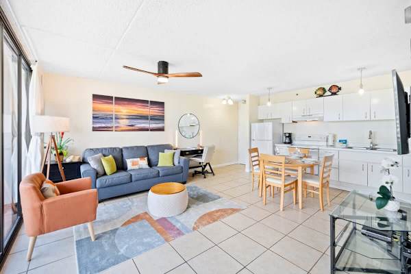 Living room with pull-out sleeper sofa, and dining table with 4 seats.
