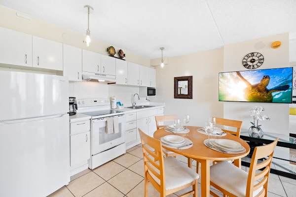 Fully equipped kitchen and dining table for up to four people.