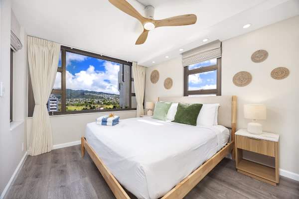 Relax in your bedroom with a king-size bed and a ceiling fan for added comfort