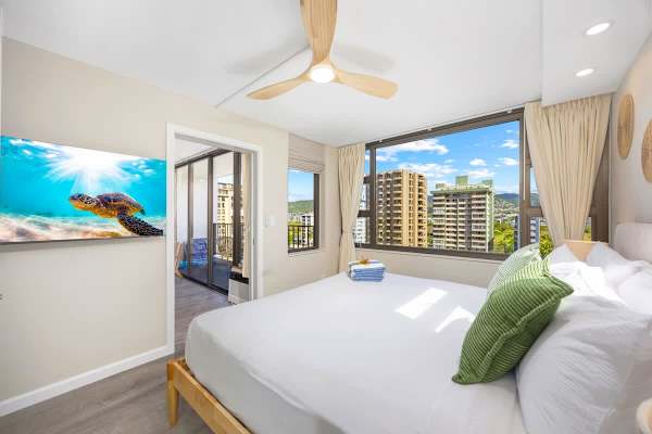 Relax in your bedroom with a king-size bed and a 50" smart TV