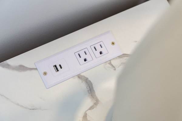 Stay connected effortlessly with built-in bedside charging ports and outlets.