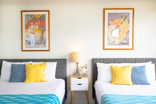 Bedroom with one queen-size and one full-size bed