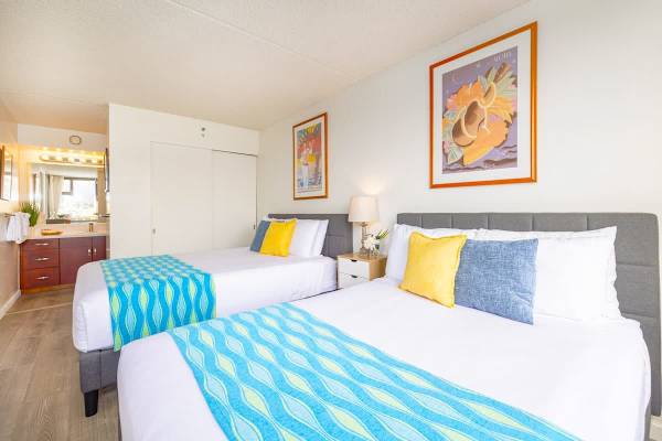 Bedroom with one queen-size and one full-size bed