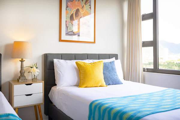 Bedroom with one queen-size and one full-size bed