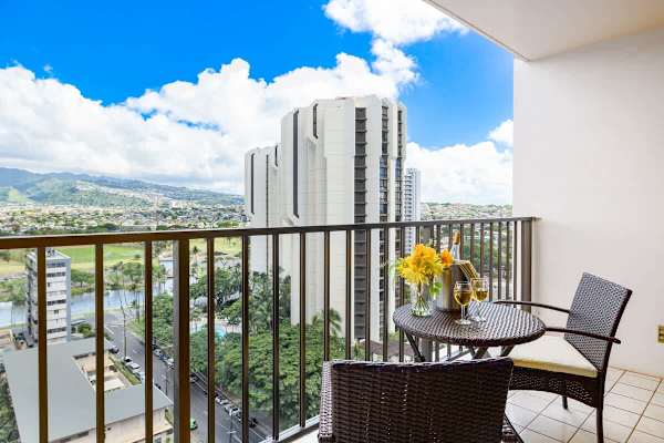 Spacious balcony with patio furniture