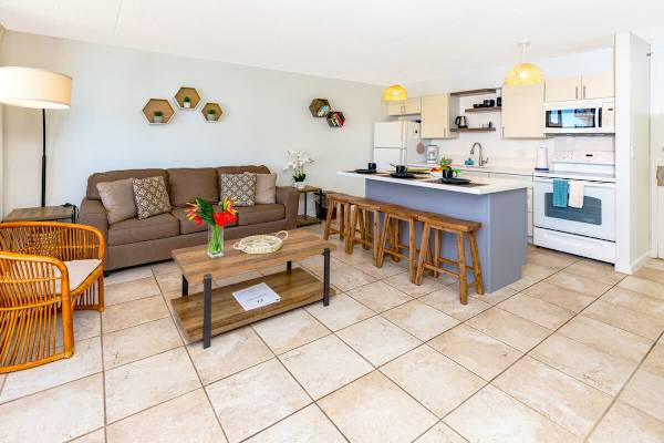 Open-concept living area with a modern kitchen island and cozy seating.