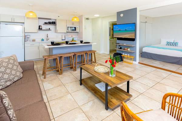 Open-concept living space with a modern kitchen and cozy seating area.