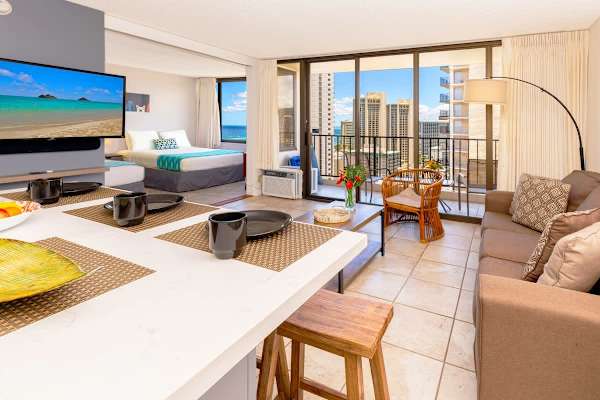 Bright living area with city views and a cozy seating arrangement.