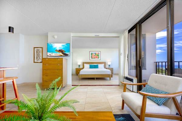 Cozy bedroom w/ warm wood tones & a bed that invites a deep, restful sleep.
