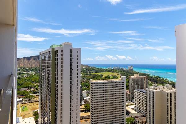 Marvel at the breathtaking city and ocean views from the balcony, offering a panoramic backdrop to your stay.