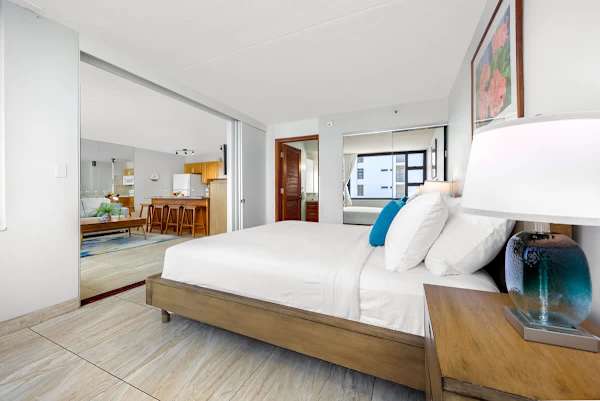 Comfortable bedroom w/ soft tones & thoughtful touches for a relaxing stay.
