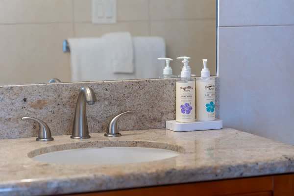 Bathroom sink w/ essentials stocked & ready for your stay.
