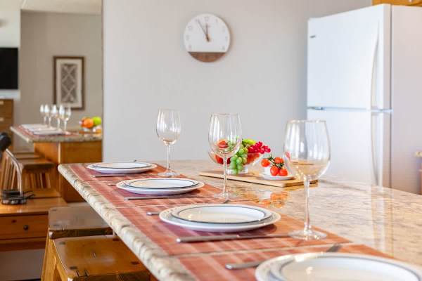 Dining area dressed up & ready to host — stylish details make every meal feel special.
