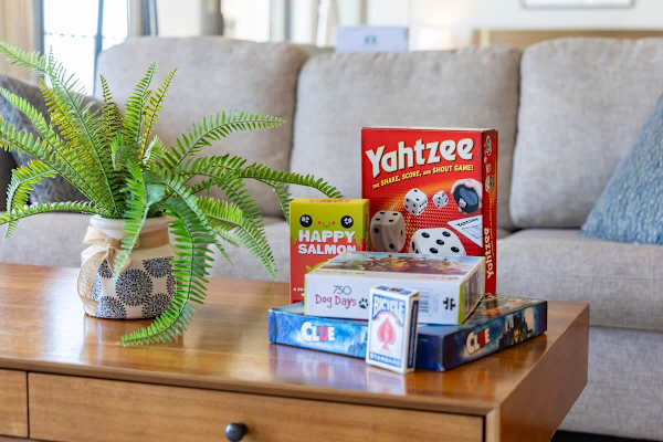 Living room stocked w/ board games — perfect for a fun night in w/ the group.
