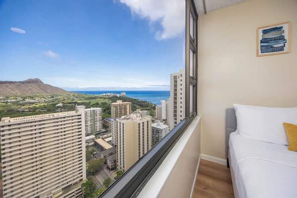 Relax in this bright room with panoramic city and ocean views.