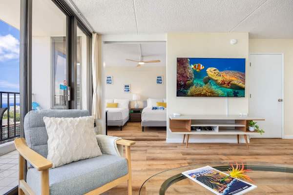 Modern living area with ocean views and a cozy seating space.