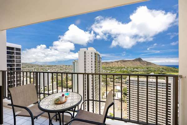 Relax on the balcony with a panoramic city and mountain view.