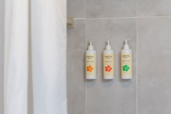 Shampoo, conditioner, and shower gel provided in the bathroom for guest convenience.