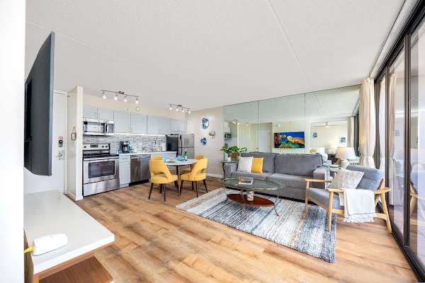 Open-concept living area with modern kitchen and bright dining space.