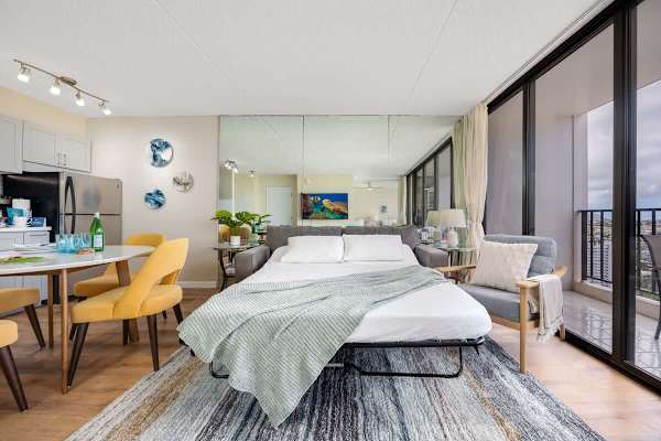 Modern condo with a pull-out sofa bed and floor-to-ceiling windows