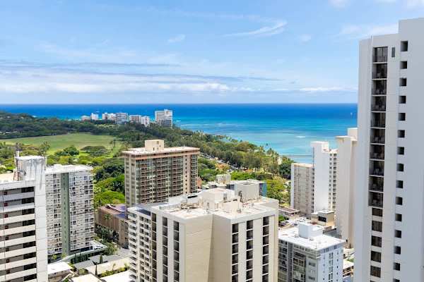 Ocean view from a high-rise building overlooking the city and coastline.