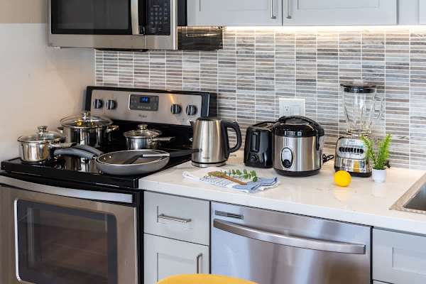 Modern kitchen with stainless steel appliances and a tiled backsplash