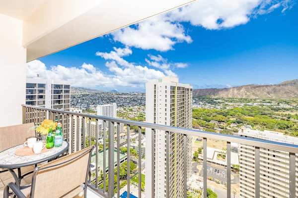 Relax on the balcony with panoramic city and mountain views.